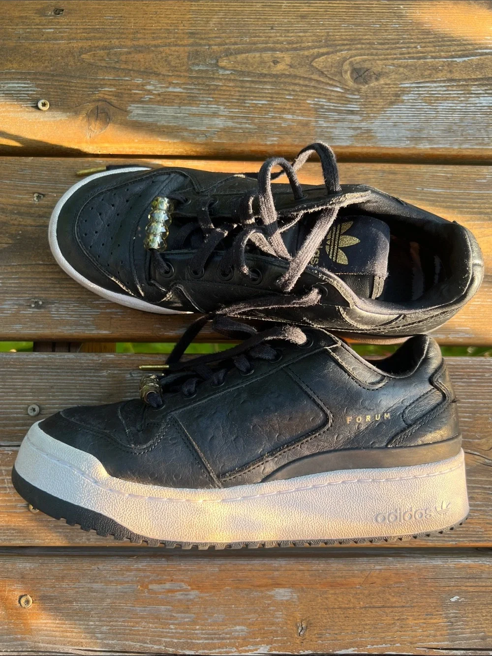 adidas Forum Black Leather Low-Top Sneakers with Gold Accents